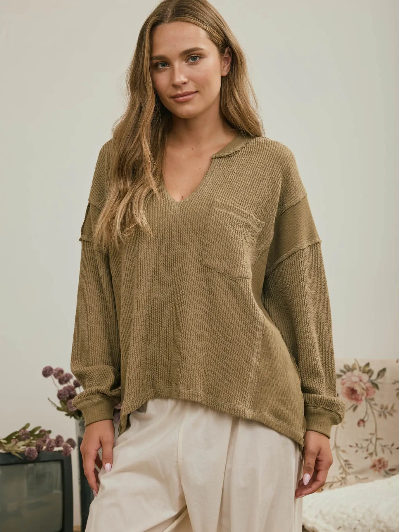 SPLIT NECK RAW EDGE LONG SLEEVE RIBBED KNIT TOP